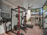 OUTDOOR COVERED FOR EXERCISE ROOM WITH CEILING FAN AND LIGHTS (EQUIPMENTS NOT INCLUDED).