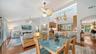 Open dining area flows easily between the kitchen, living room and outdoor spaces.