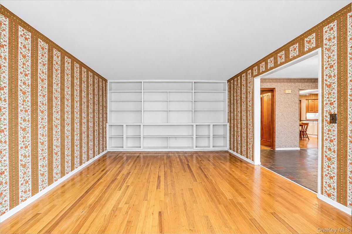 with hardwood floors and bookcases