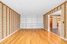 with hardwood floors and bookcases