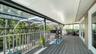 Expansive screened balcony provides additional outdoor living and entertaining space.