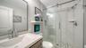Another view of the guest bedroom showcasing its comfortable proportions.