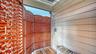Outdoor shower adds convenience after a day at the pool or beach.