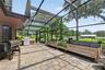 screened lanai by pool / herb garden / grilling area