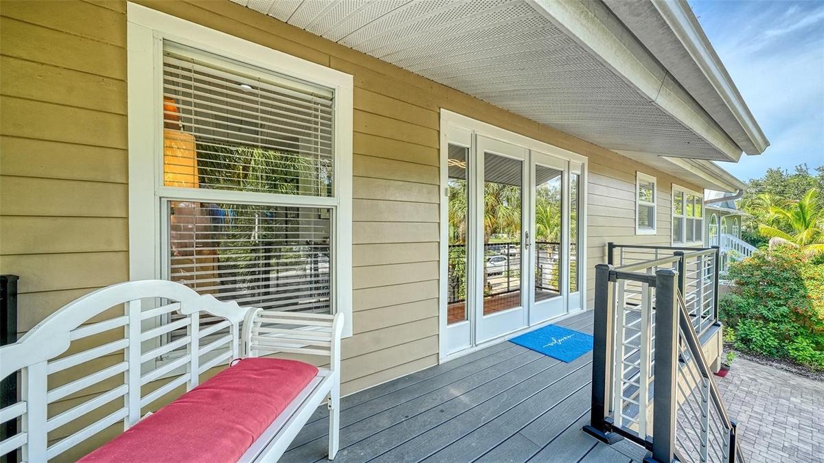 Welcoming covered front porch with composite decking.
