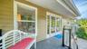 Welcoming covered front porch with composite decking.
