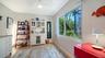 Flexible office with built-in storage and natural light.