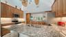 Remodeled kitchen with granite countertops, custom cabinetry and stainless steel appliances.
