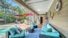 Covered poolside seating creates a comfortable shaded retreat.