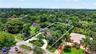 Large property with gorgeous grounds and mature trees, view of guest house on north and main house on south, separated by fence