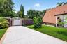 Extra long driveway on main house side with storage shed, and additional 2 more beautiful air conditioned sheds which can be used for office space, as