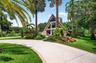 Beautiful resurfaced driveway, plenty of parking for at least 8 vehicles on main house side, plus parking for several more cars on guest house side