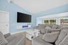 Oversized primary bedroom w/ beamed ceiling, Plantation Shutters and large walk in closet, en suite bathroom, on main level