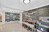 Great room or Dining Room downstairs, off kitchen, beyond this space are doors to front of house. Come right in here w/ your groceries. Beachy paneled