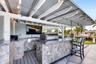 Outdoor Kitchen w/ Grill, Sink, Covered Seating, TV hookup