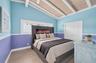 Great room or Dining Room downstairs, off kitchen, beyond this space is bedroom #4. Beachy paneled walls