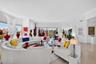 Part of unit 303. Bright / Modern Unit w/ all Marble Flooring, views to Downtown, Impact Windows & Doors. This is a large living room.