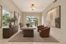 This is a bedroom or office. Virtually enhanced photo