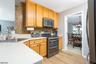 KITCHEN OPENS TO DINING AREA