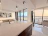kitchen with view to living room and open countertop