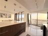 kitchen with view to living room and open countertop