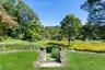 Stone steps to garden and meadows.