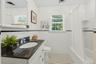 A beautifully appointed hall bath, convenient to the bedrooms.