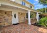 Brick paver entryway with stone facade accents