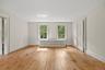 Primary Bedroom with Walk-in Closet and Gleaming Hardwood Floors