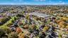 Aerial view of property's location with nearby suburban area