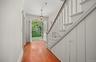 Front Entryway with Front Staircase from Porch