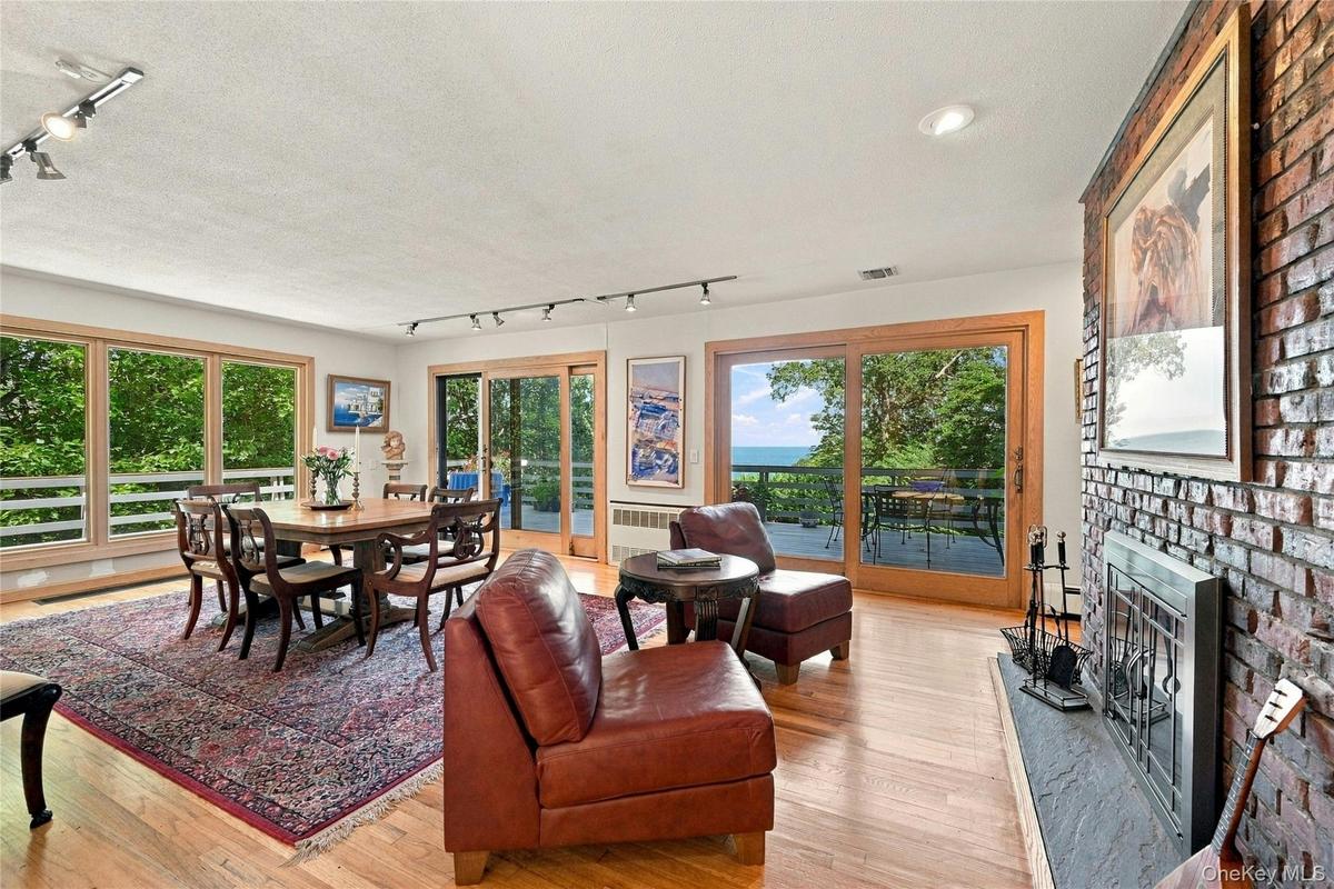 Formal Dining with Double Sided Fireplace and Water Views