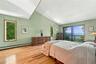 Primary Bed with Sliding Doors to Private Balcony and Water Views