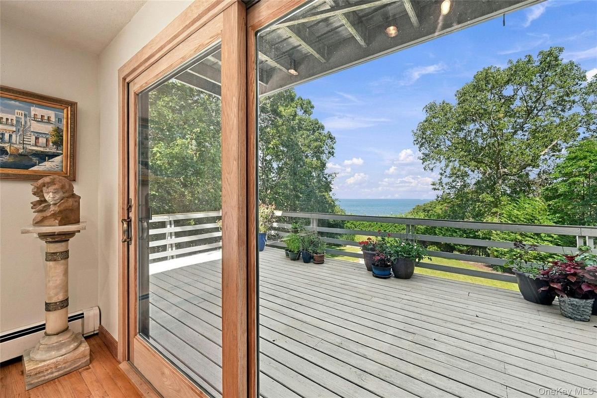 Balcony off Formal Dining with Sliding Doors and Water Views