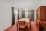 Dining area featuring light carpet and a chandelier