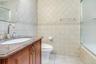Bathroom with tub and frameless shower doors, granite vanity
