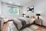 Virtually Staged bedroom with wood floors