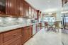 Top of the line Eat in kitchen with granite counters and backsplash, European designed cabinets with soft close