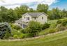 Looking down at house from top stone wall