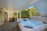 Hot tub and storage under the deck stairs