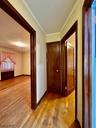 Hall to beds w/linen closet