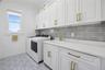 First floor laundry with designer tile