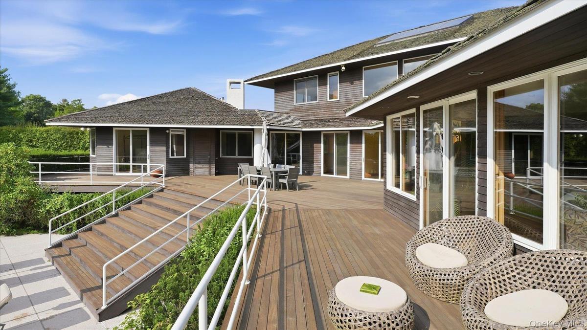 Wrap-around deck with guest bedroom at the end of the deck