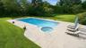 The pool with jacuzzi spa.  Note mature landscaping for privacy