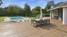 Al fresco deck dining with view to pool