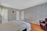 Large Primary Bedroom with walk in closet and bathroom access.