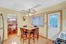 Wood-finish flooring throughout, with a ceiling fan light fixture