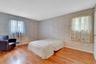 Primary Bedroom with Hardwood flooring