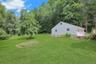 A beautiful view of the expansive, level yard, offering plenty of space for outdoor entertaining and recreation!