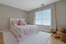 Bright spacious bedroom located on the second level